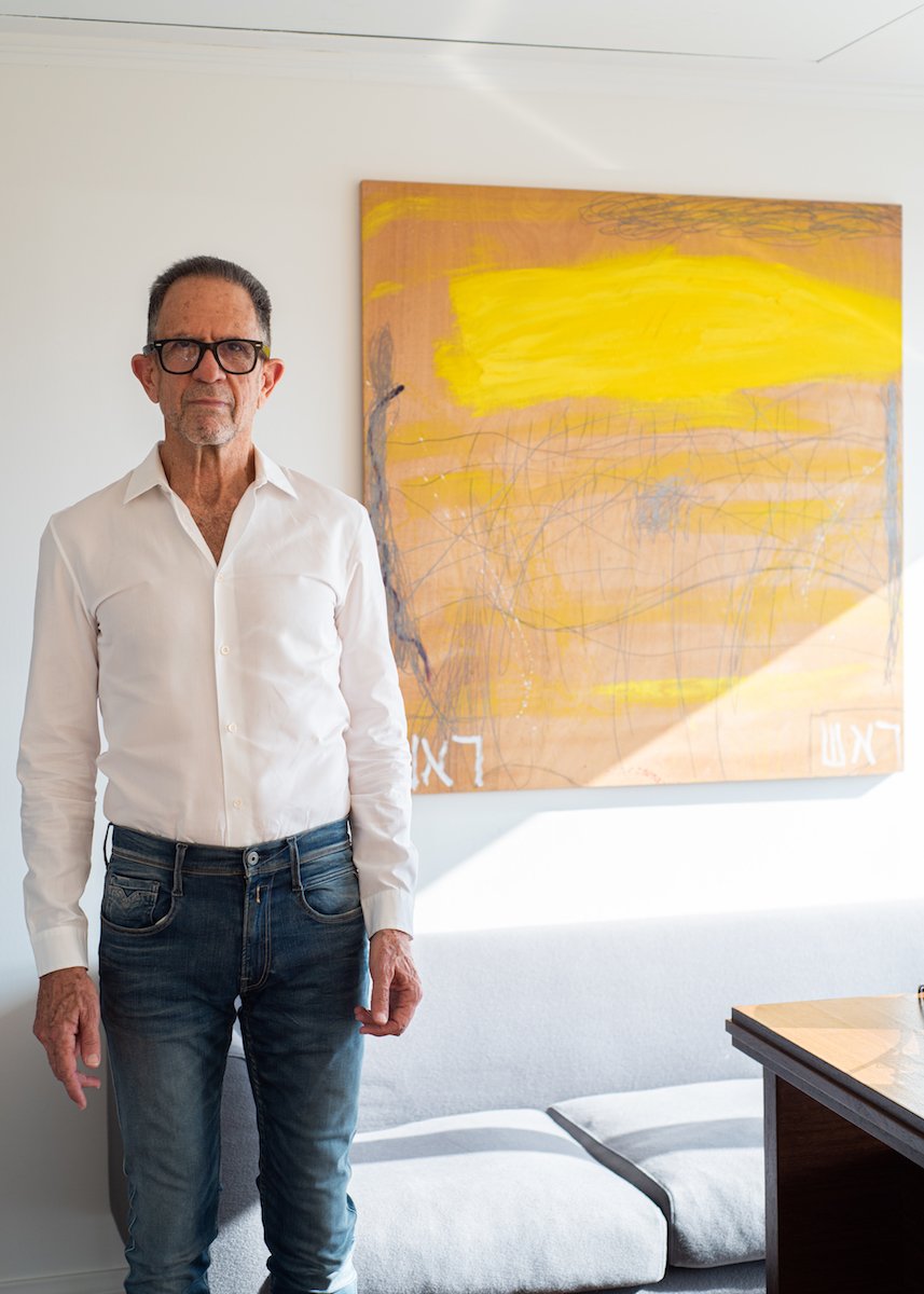 Igal Ahouvi in his Office in Tel Aviv. Behind: Raffi Lavie, Untitled, 2005. Photo: Guy Ahouvi. Courtesy of Igal Ahouvi.