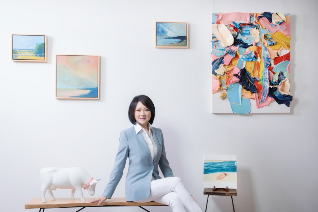 Maggie Tsai sitting next to the painting by Zhu Jinshi (upper right). Courtesy of Fubon Art Foundation. 