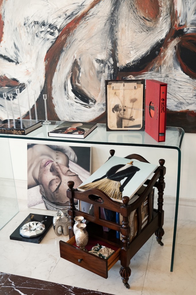 Two paintings and an art book by Nasser Bakhshi, Art books by Iranian master artists Aydin Aghdashloo and Parviz Tanavolli. Photo: Atoosa Alebouyeh