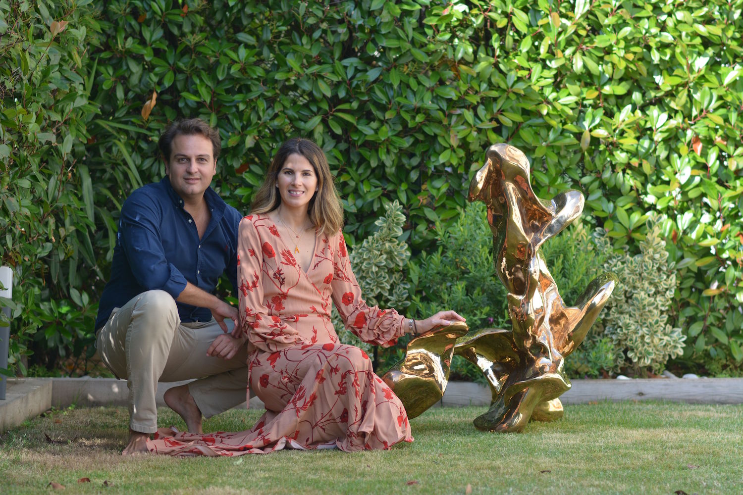 The Lazaros with a sculpture by A Kassen artist group. Courtesy of Alejandro Lazaro.