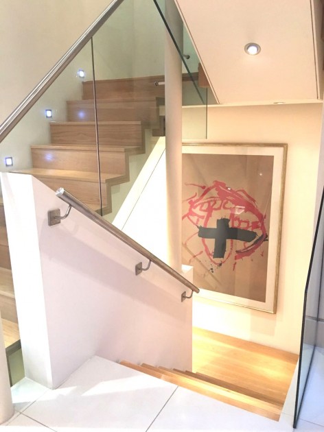 An artwork by Antoni Tapies is lighting up the staircase. Courtesy of Antonio Mugica. 
