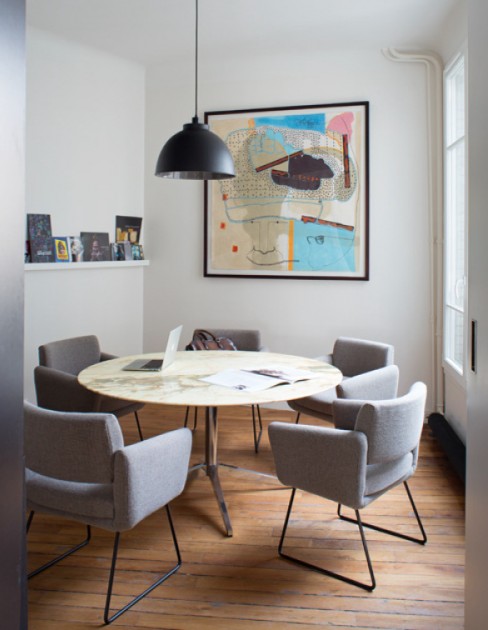 A piece by Jean-Michel Alberola is above the chairs by designer Joseph-André Motte and the table designed by Eero Saarinen, at the office of Communic'Art. Photo: Jean-François Jaussaud. Courtesy of François Blanc.