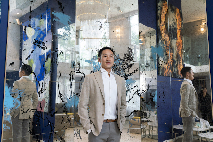 Evan Chow surrounded by Nick Mauss' artwork. Photo: TR_ConceptnVisual. Courtesy of Evan Chow.