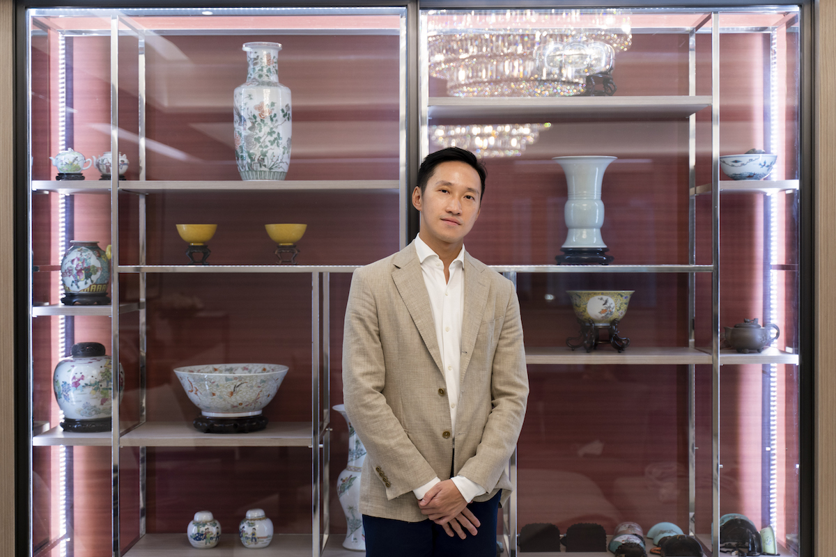 Evan Chow in front of a fine collection of Chinese antiques. Photo: TR_ConceptnVisual. Courtesy of Evan Chow