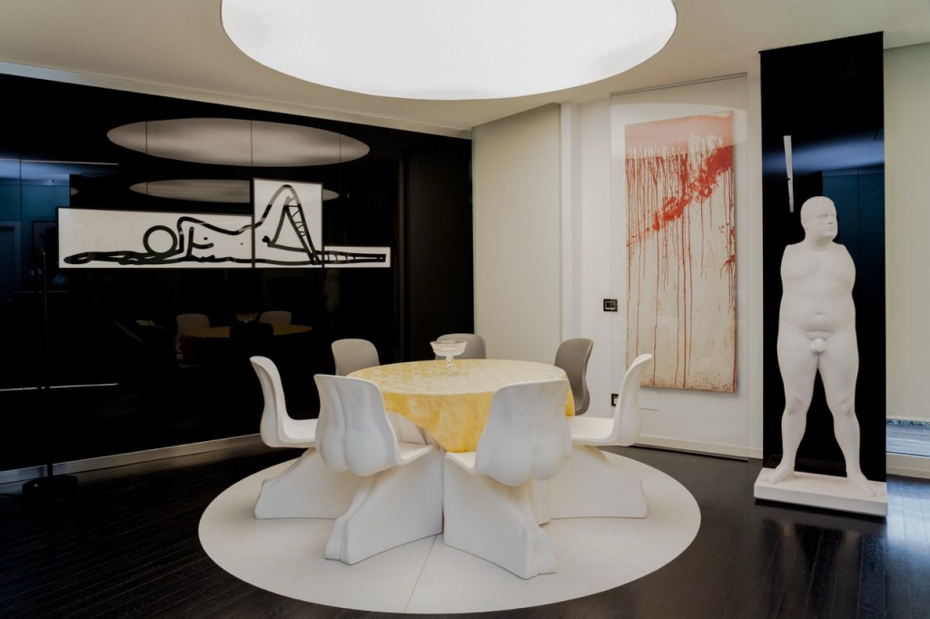 Giuseppe's dining room with works by Julian Opie, Hermann Nitsch, and Marc Quinn. Courtesy of Giuseppe Simone Modeo