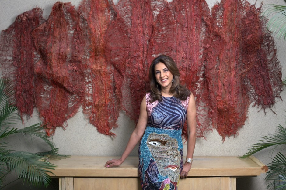 Kavita Chellaram in front of Nnenna Okore's wall sculpture. Courtesy of Kavita Chellaram.