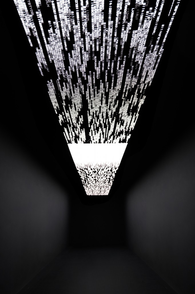 Ryoji Ikeda, "data.flux [nº1]", 2020, OLED monitor displays, computers and speakers, W 0.8 × D 14.5 m. Courtesy of the collector.