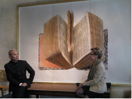 Liu Dan in conversation with Jane DeBevoise, Chair of the Board of Directors of Asia Art Archive in Hong Kong and New York, in front of The Dictionary, 81 x 121 inches, watercolor on paper, 1991. Photo: Asia Art Archive.