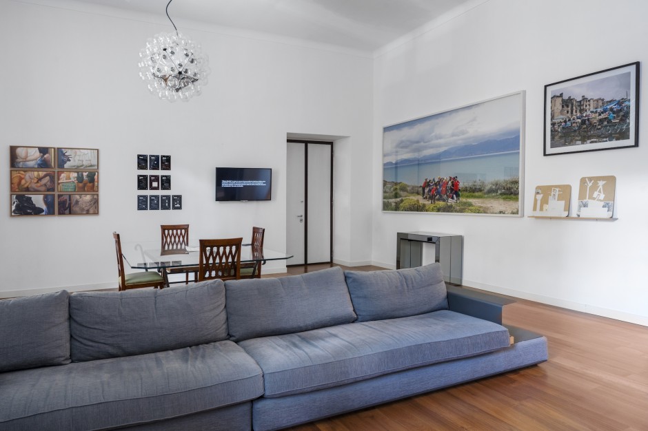 Francesco Taurisano’s apartment. In the living room, works by Nuria Guell, Marinella Senatore, Simon Roberts, Marko Tadic (from left to right). Courtesy of CollezioneTaurisano. Photo: Maurizio Esposito. 