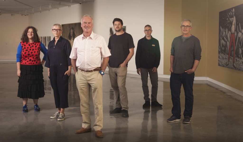 Artists line up is from left to right, Emily Floyd, Mikala Dwyer, Michael Buxton, Nick Mangan, David Rozetsky and James Morrison, and each have work in the inaugural exhibition, The shape of things to come. Photo: Eamon Gallagher. Courtesy of Buxton Contemporary.