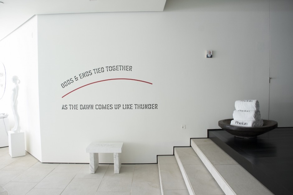 Works by Jim Torok, Lawrence Weiner, Jenny Holzer and Don Brown next to the indoor swimming pool. Photo: Emily Hoerdemann. Courtesy of Amy Phelan.