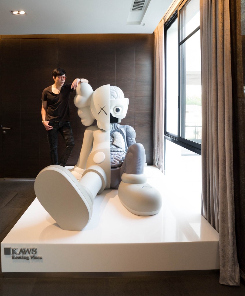 Kong with KAWS sculpture. Courtesy of Kong Karoon Sosothikul. 