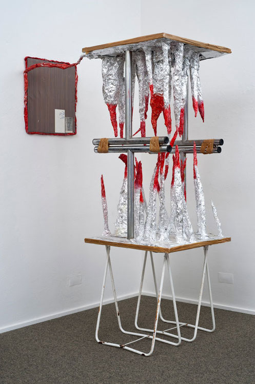 Thomas Hirschhorn, Untitled (Stalactites-red-table), 1997. Courtesy of Sammlung Peters-Messer.
