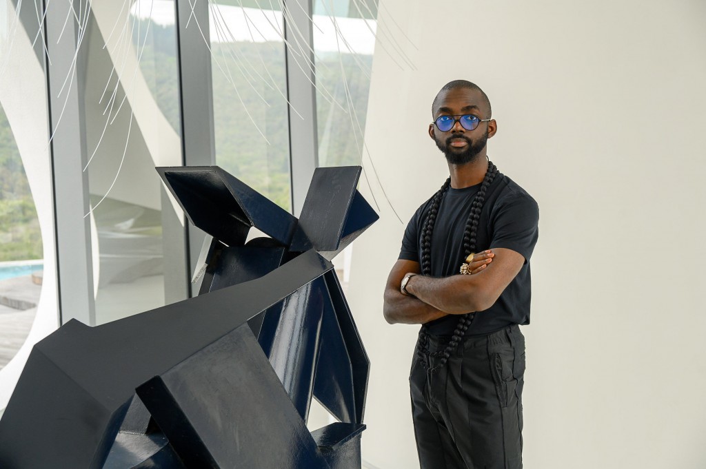 Joseph next Edoardo Villa's sculpture. Courtesy of Joseph Awuah-Darko