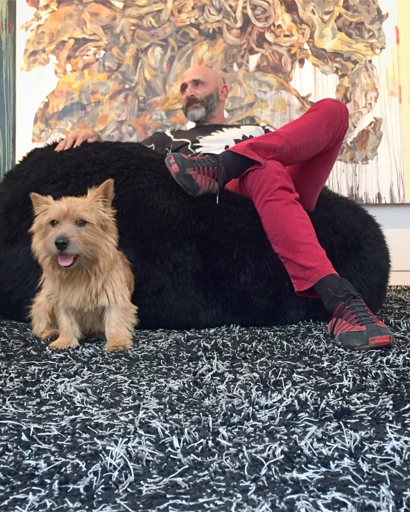 Jeffrey N. Dauber and his dog Woddy, with a piece by Hung Liu at the back. Photo: Tito Vandermeyden. Courtesy of Jeffrey N. Dauber.